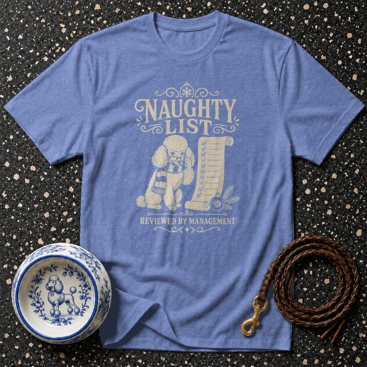 Blue t-shirt with poodle, naughty list, and "reviewed by management" text.