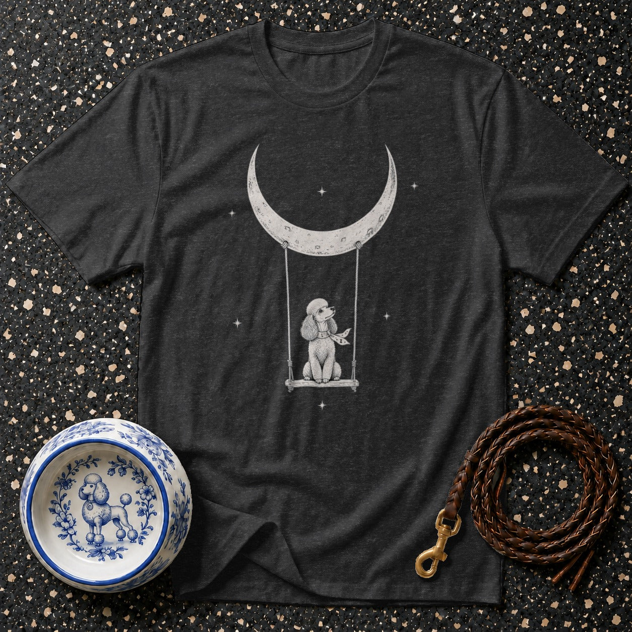 Dark t-shirt with poodle on a crescent moon swing graphic.