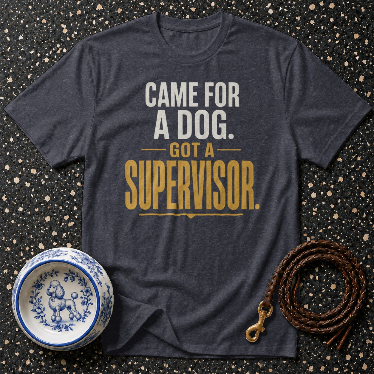 Dark t-shirt with text "CAME FOR A DOG. GOT A SUPERVISOR." with dog bowl and leash.