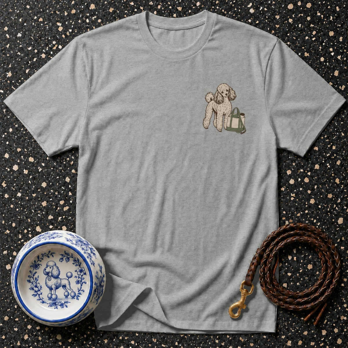 Grey t-shirt with embroidered poodle and tote bag on the left chest.