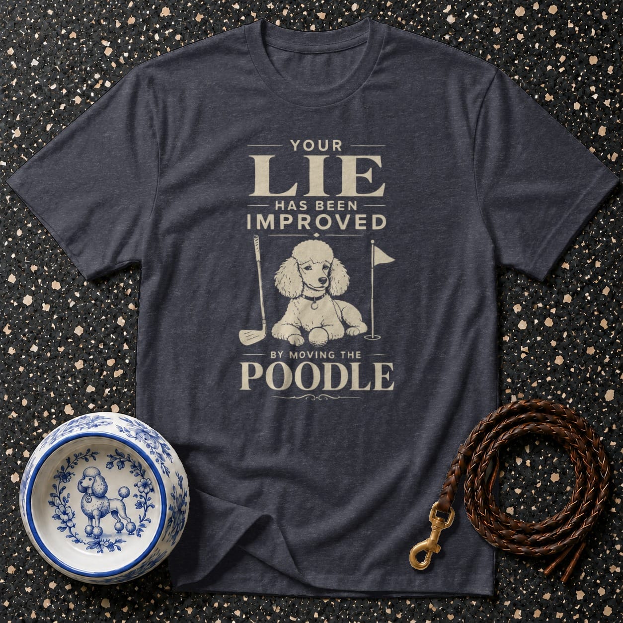 Dark blue t-shirt with a poodle on a golf course graphic and text.