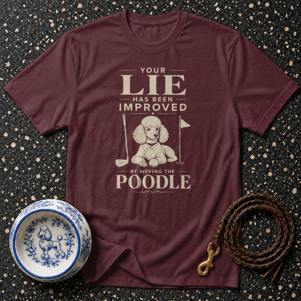 Maroon t-shirt with "Your lie has been improved by moving the poodle" text and poodle graphic.