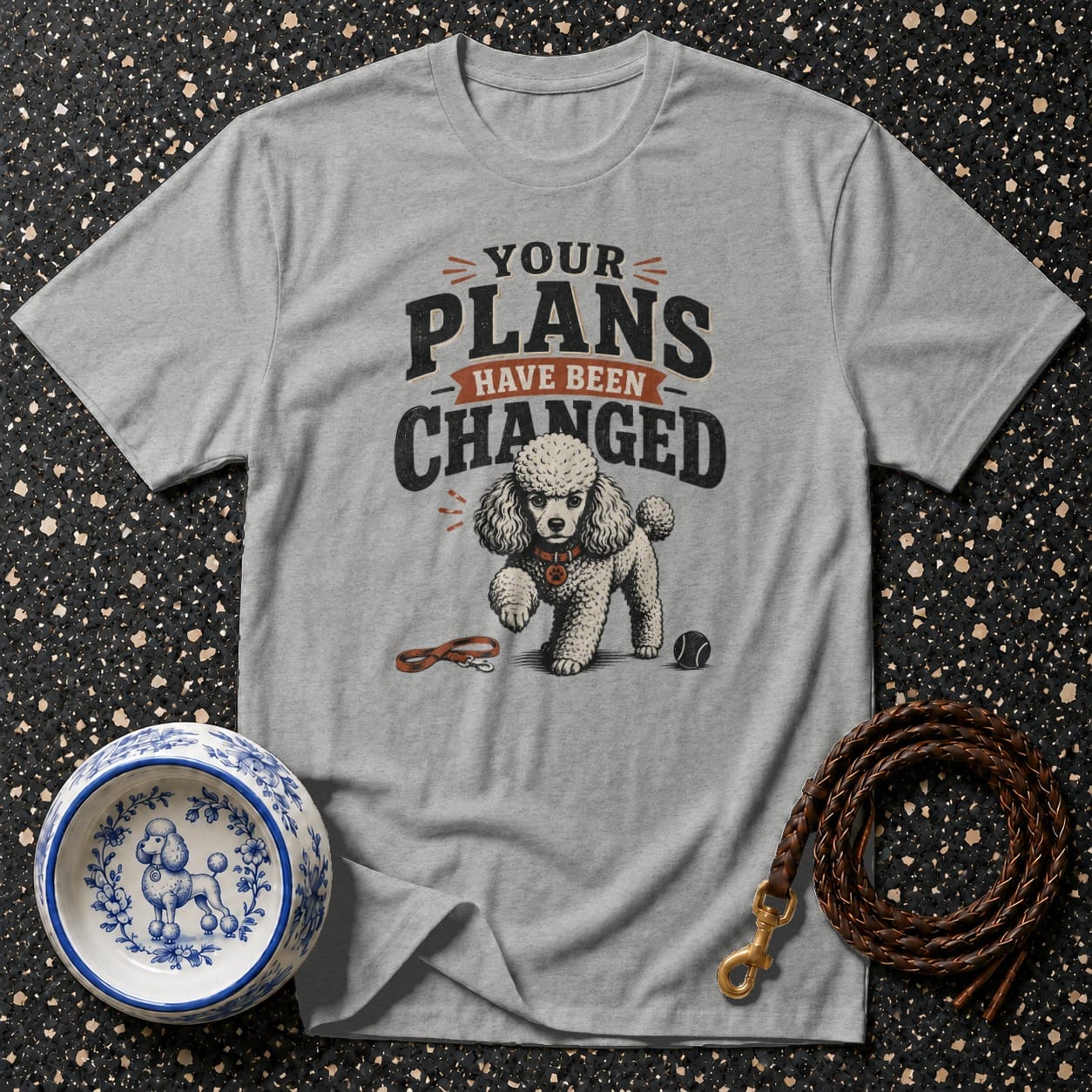 Grey t-shirt with "YOUR PLANS HAVE BEEN CHANGED" text and poodle graphic.