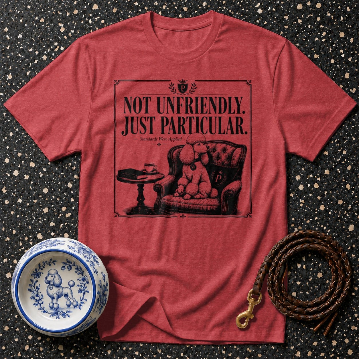 Red t-shirt with black poodle illustration and text "NOT UNFRIENDLY. JUST PARTICULAR."