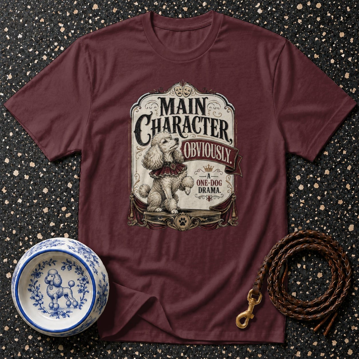 Maroon t-shirt with "Main Character Obviously - A One-Dog Drama" graphic featuring a poodle.