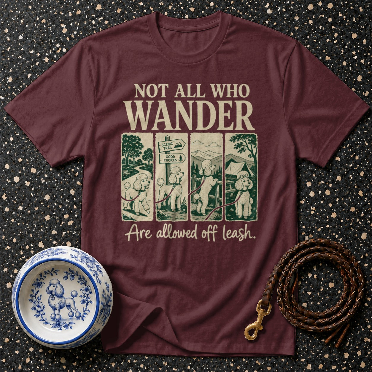 Maroon t-shirt with "NOT ALL WHO WANDER" and poodles on leash illustration.