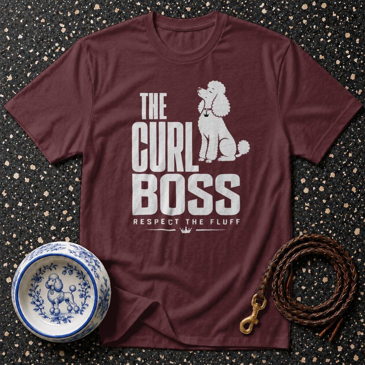 Maroon t-shirt with white text "The Curl Boss Respect The Fluff" and poodle illustration.