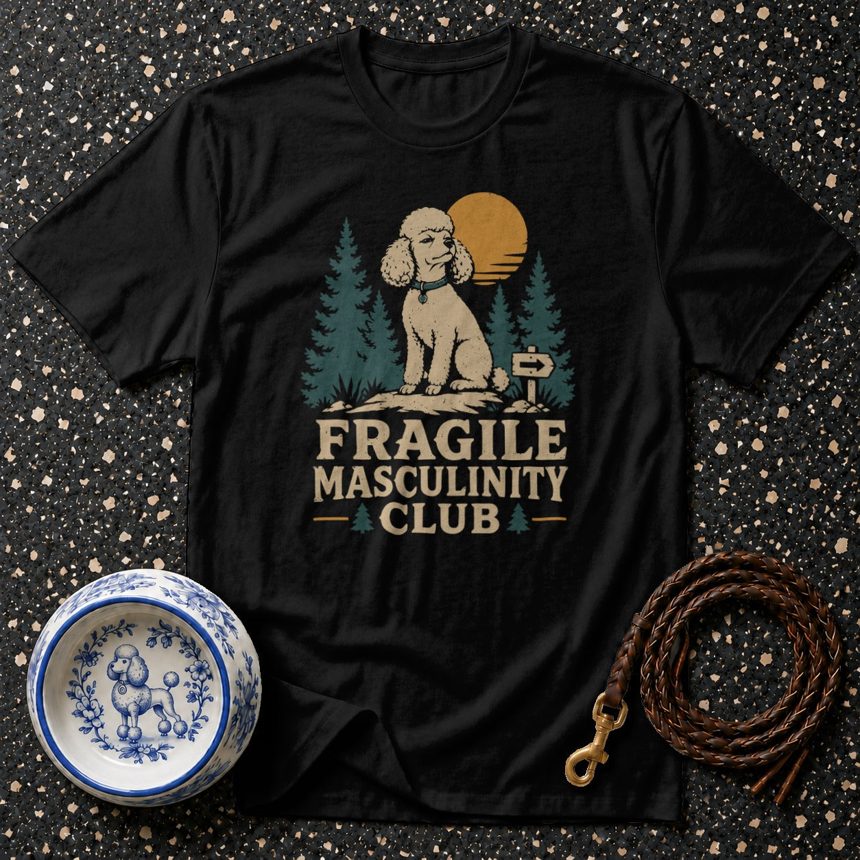 Black t-shirt with text "FRAGILE MASCULINITY CLUB" and poodle graphic.