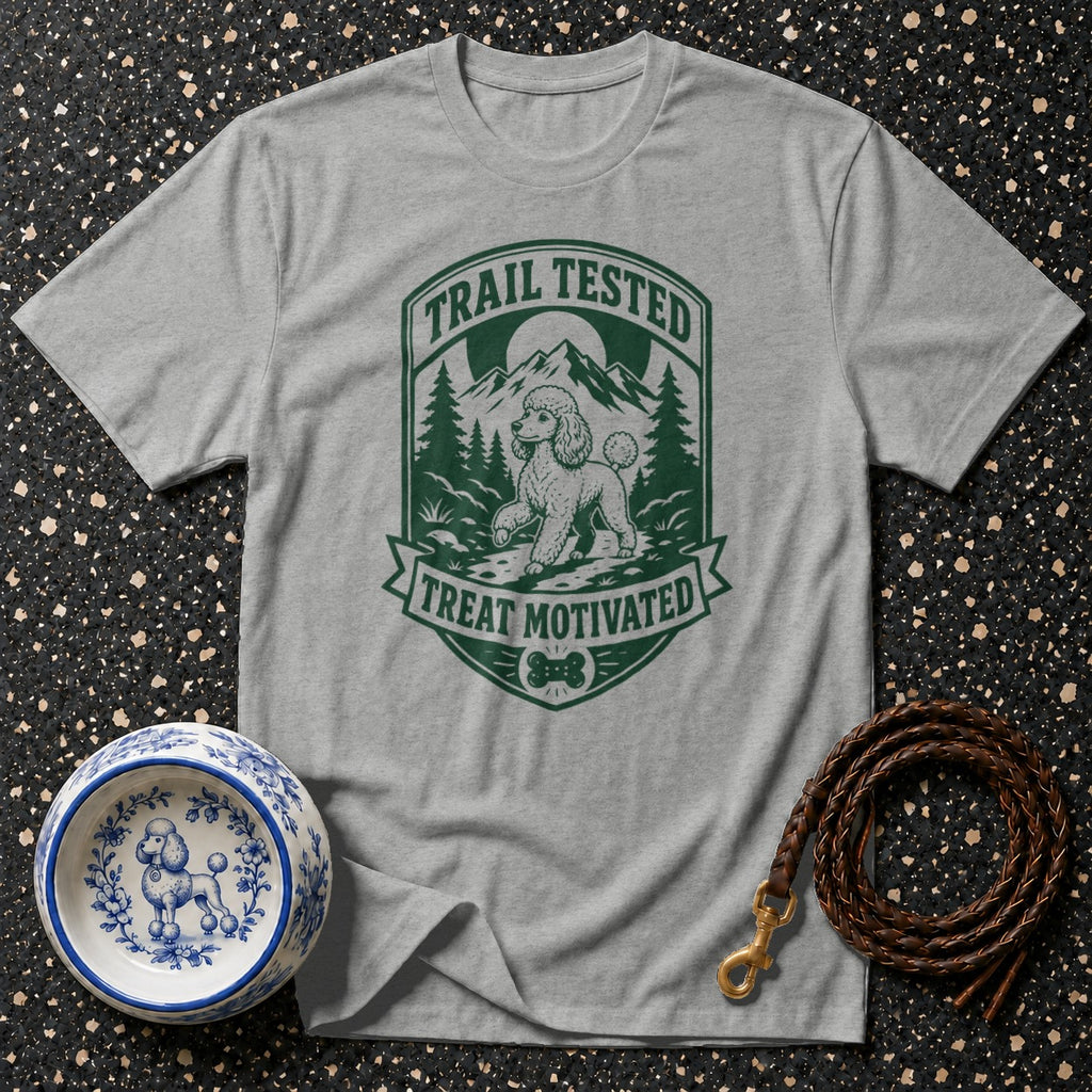Gray t-shirt with a green emblem featuring a poodle and text "Trail Tested Treat Motivated."