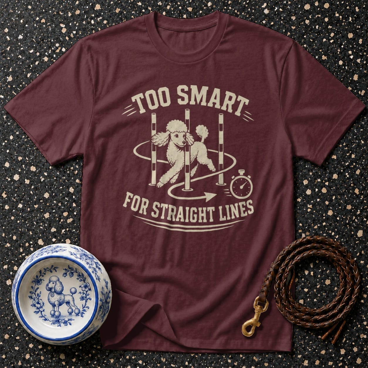 Maroon t-shirt with a poodle doing agility with text "TOO SMART FOR STRAIGHT LINES".