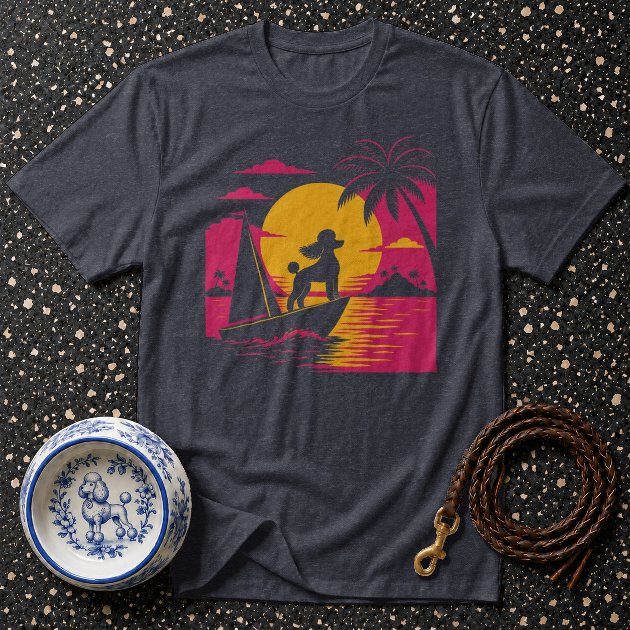 Dark t-shirt with vintage sunset poodle on sailboat graphic.