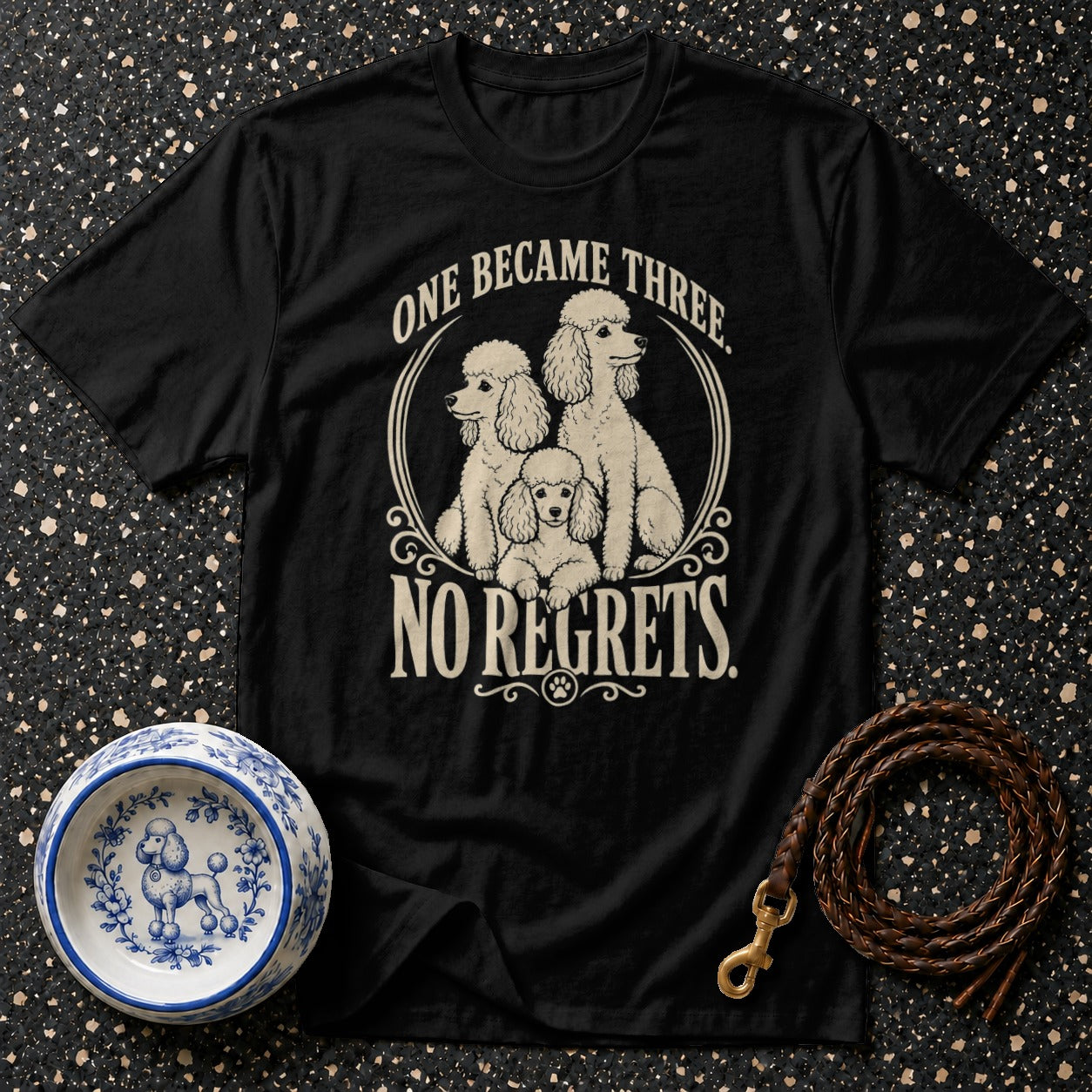 Black t-shirt with three poodles and text "one became three. no regrets."