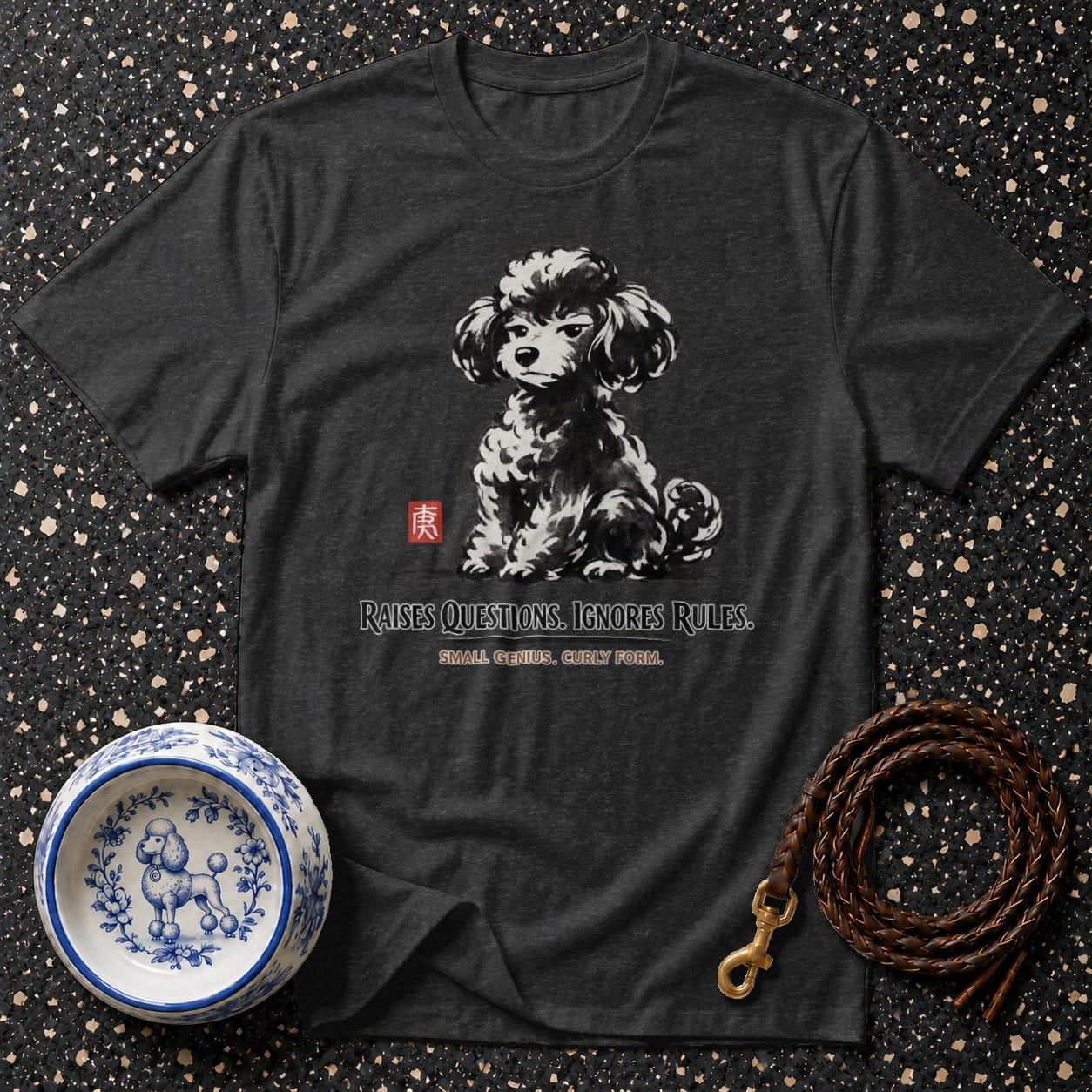 Dark grey t-shirt with a black and white poodle graphic and text: "RAISES QUESTIONS. IGNORES RULES."