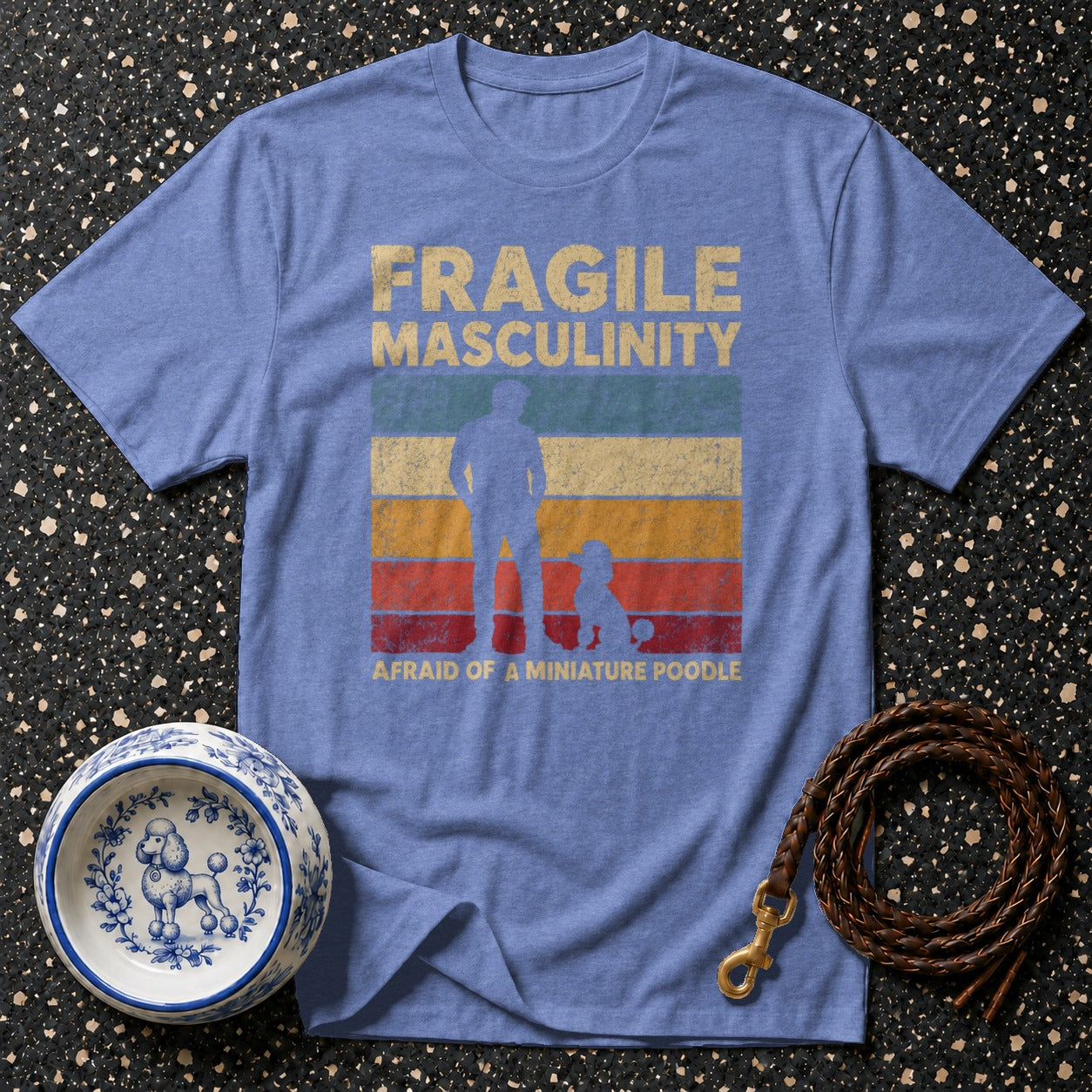 Blue t-shirt with "Fragile Masculinity" and poodle graphic.