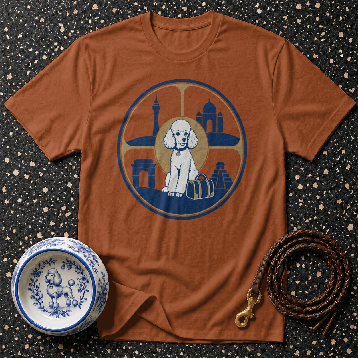 T-shirt with white poodle and travel landmarks in a circular graphic.
