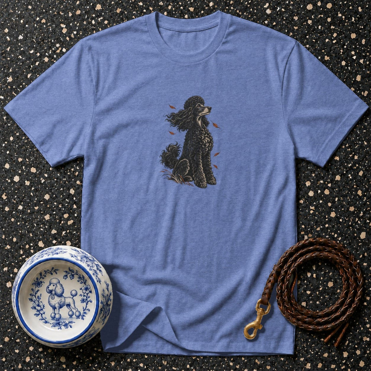 Blue t-shirt with a black poodle illustration and a dog bowl and leash.