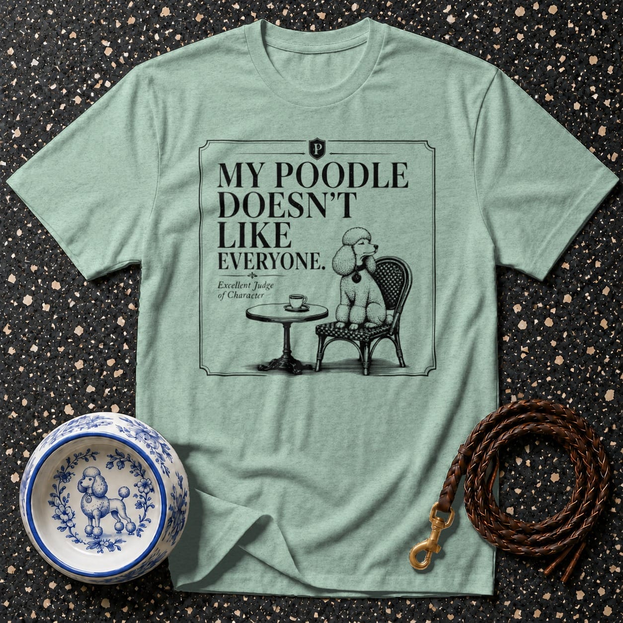 Light blue t-shirt with "My poodle doesn't like everyone" text and poodle graphic.