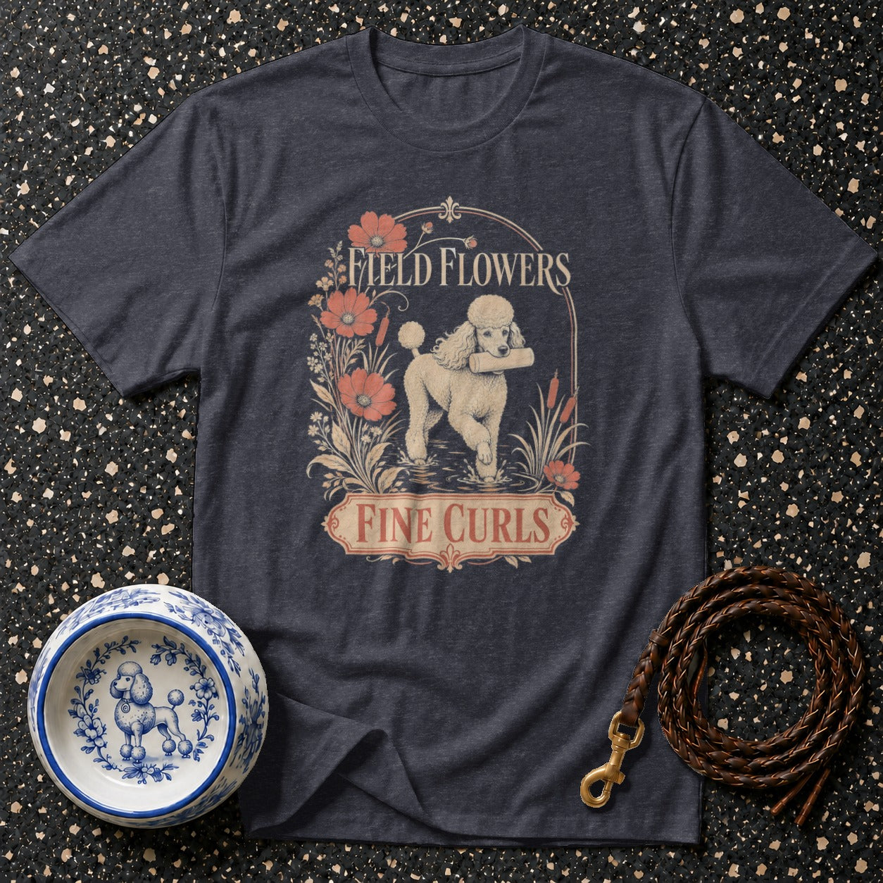 Dark t-shirt with a poodle graphic that says "Field Flowers Fine Curls".