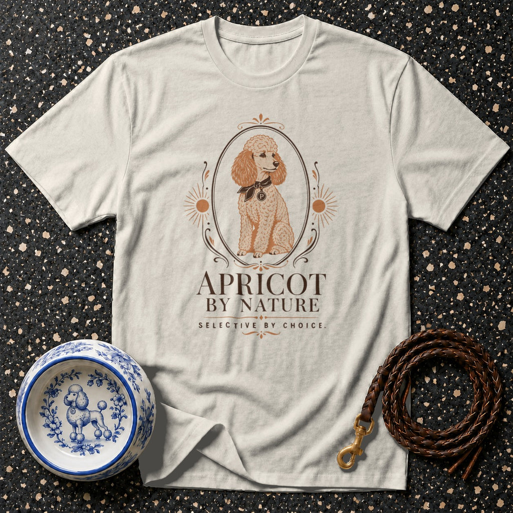 T-shirt with poodle illustration for "Apricot by Nature" brand, dog bowl, and leash.