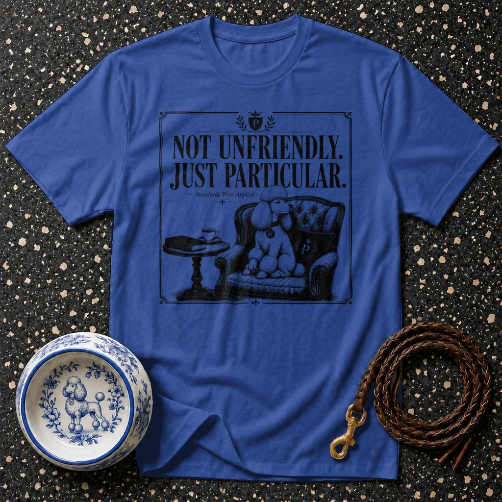 Blue t-shirt with "Not Unfriendly. Just Particular." text and a poodle on a chair.