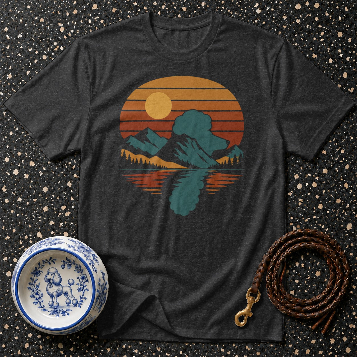Dark gray t-shirt with a retro mountain lake sunset graphic and a poodle dog bowl.