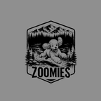 Poodle running through mountains with "ZOOMIES" text in a shield.
