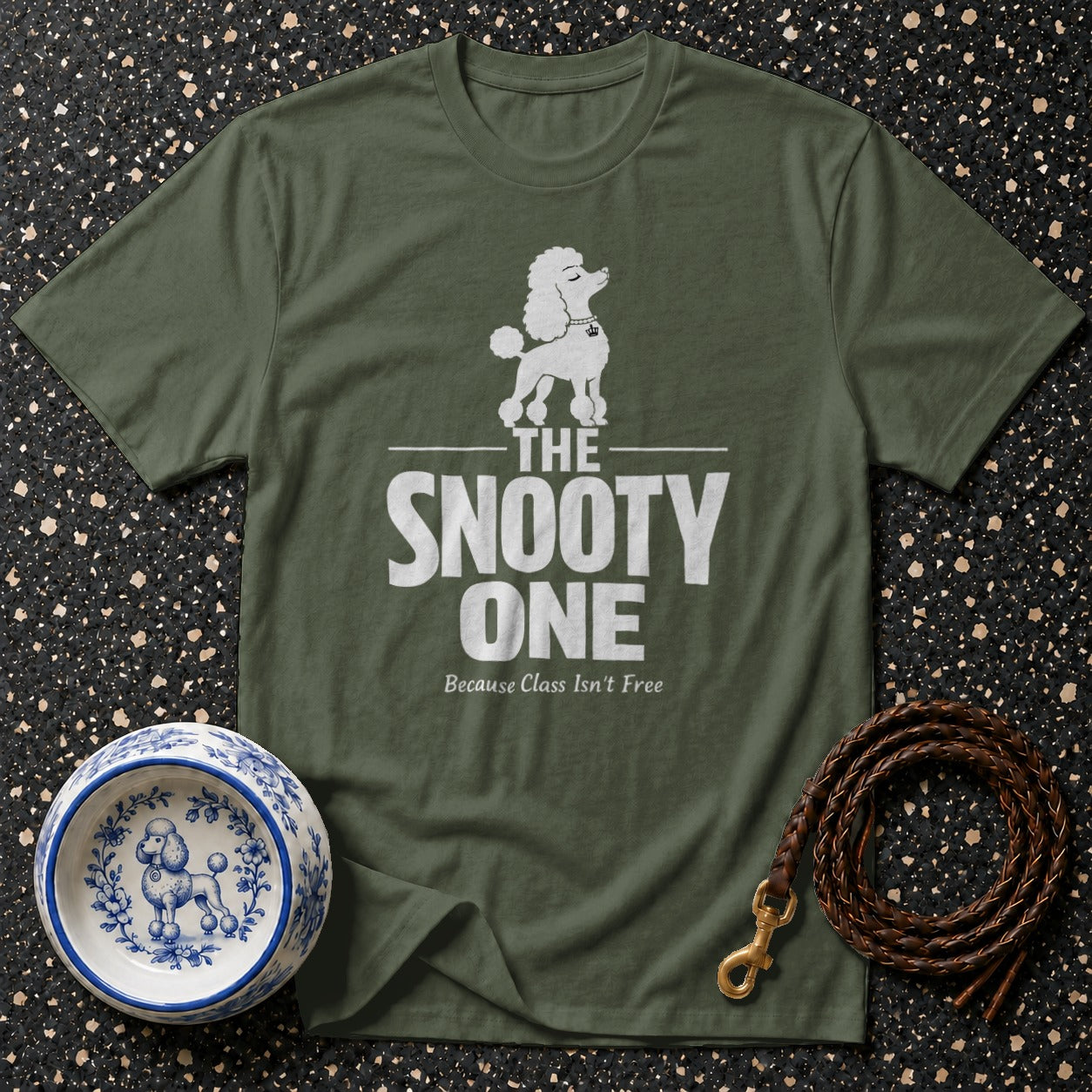 Green t-shirt with white poodle graphic and "The Snooty One" text.