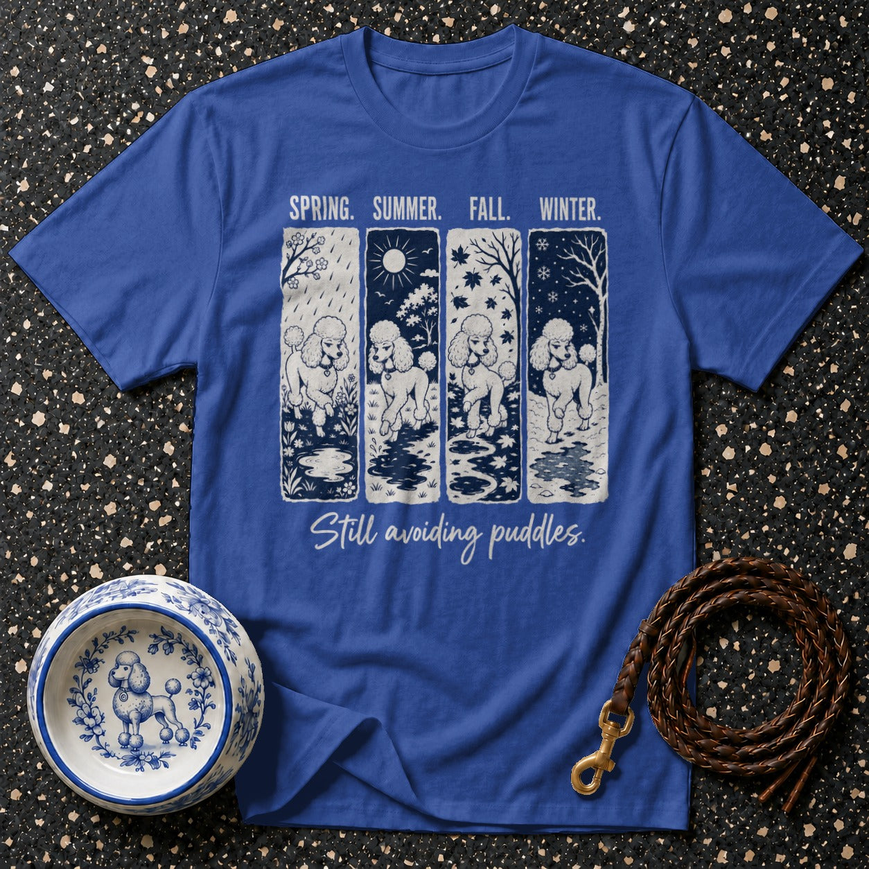 Blue t-shirt with four panels showing a poodle in spring, summer, fall, and winter.
