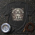 Dark t-shirt with a poodle illustration and text "BEAUTY TAKES BRUSHING."