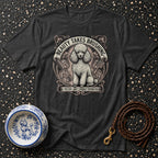 Dark t-shirt with a poodle illustration and text "BEAUTY TAKES BRUSHING."