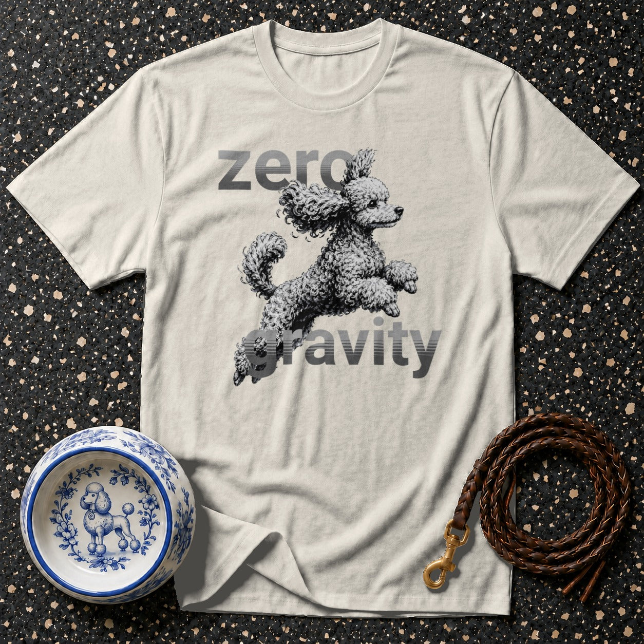 T-shirt with a poodle illustration and text "zero gravity".