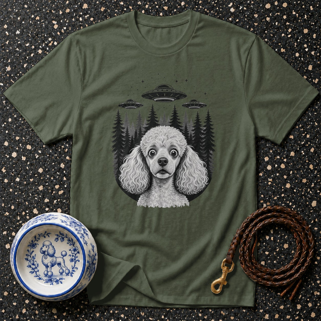 Olive t-shirt with poodle, UFOs, and trees graphic. Blue and white poodle bowl and leather leash nearby.