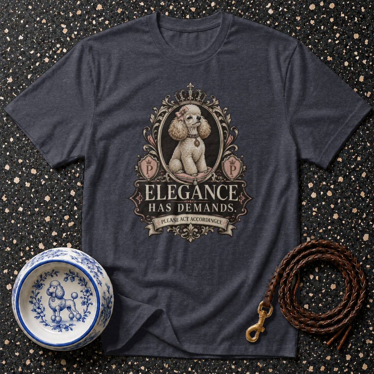 T-shirt with framed poodle, crown, crests, and text "Elegance Has Demands."
