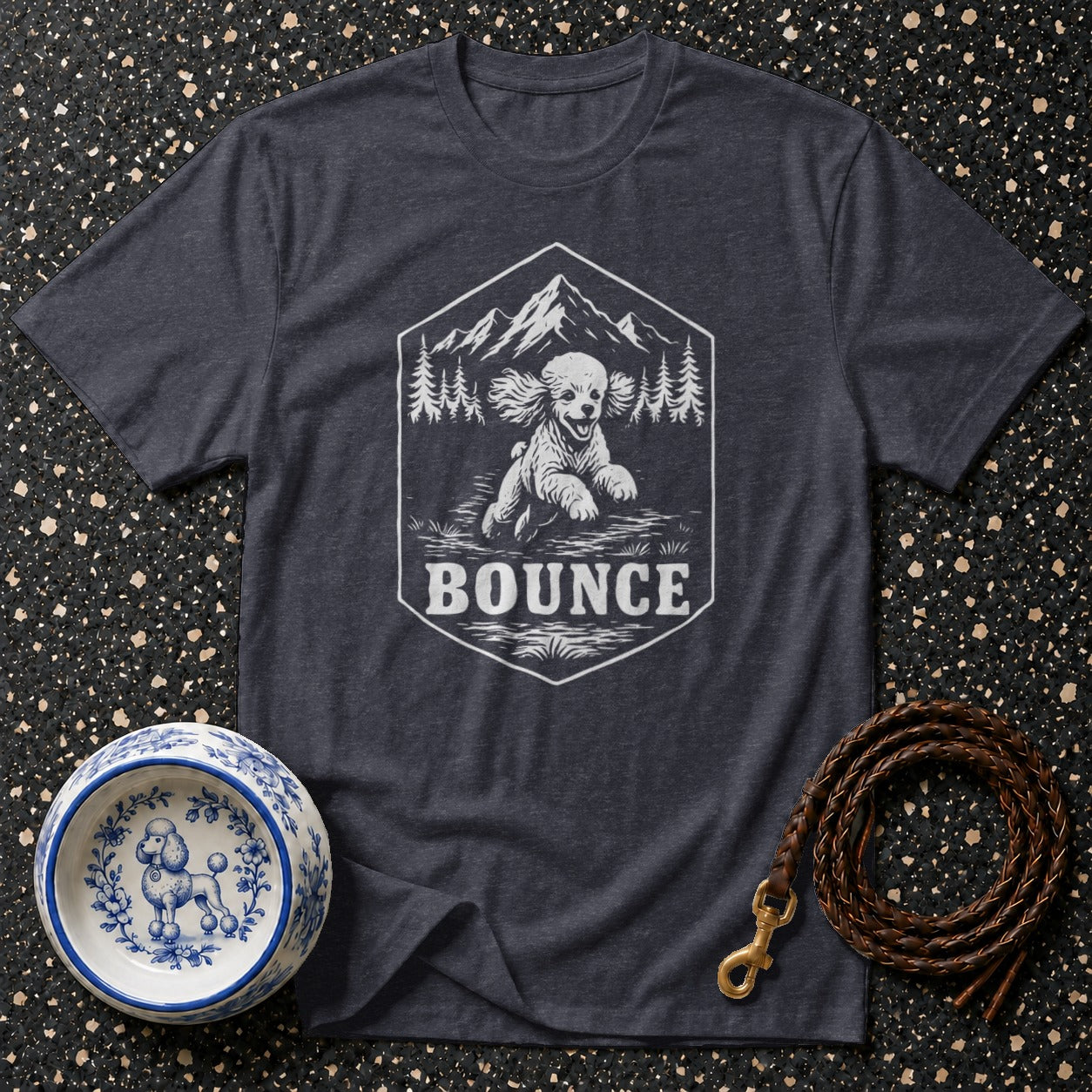 Dark grey t-shirt with a white hexagonal graphic of a running dog, mountains, and trees.