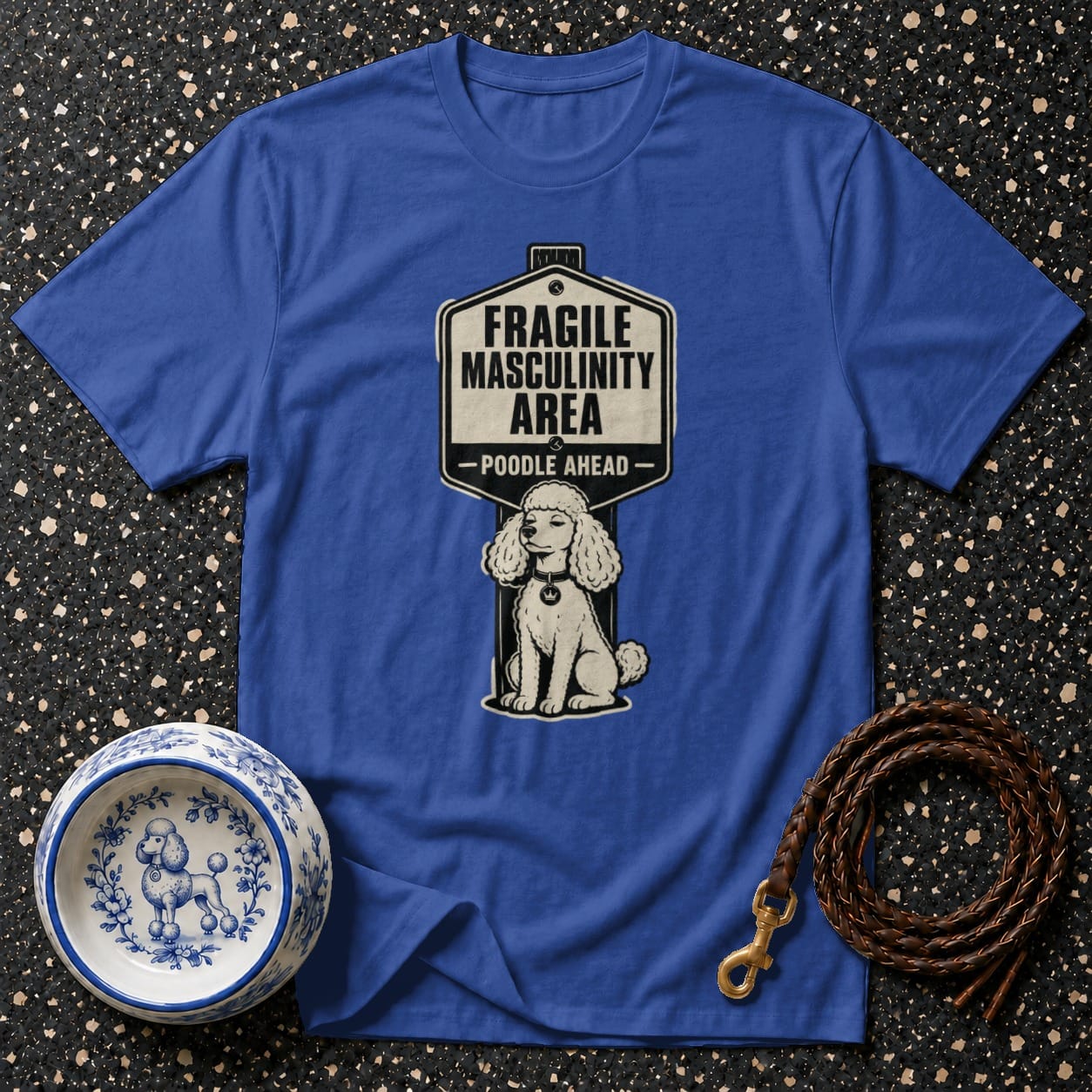 Royal blue t-shirt with graphic of a poodle and "Fragile Masculinity Area - Poodle Ahead" sign.