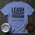 Blue t-shirt with "LEASH LEADERSHIP PROGRAM HUMANS IN TRAINING." text.