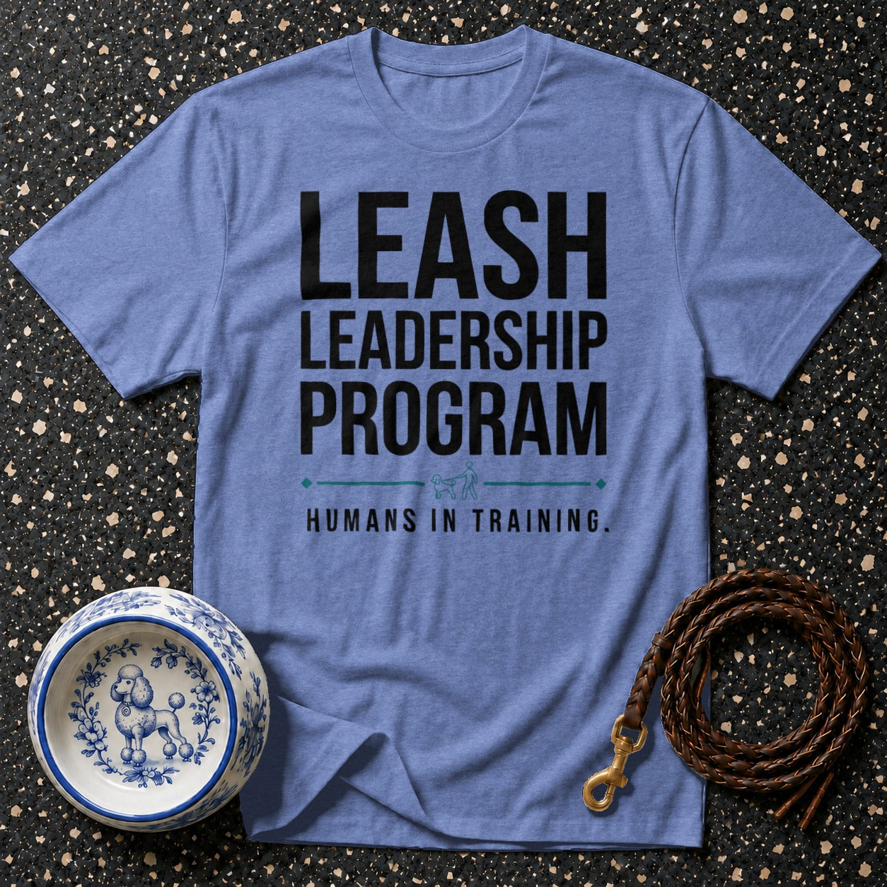 Blue t-shirt with "LEASH LEADERSHIP PROGRAM HUMANS IN TRAINING." text.