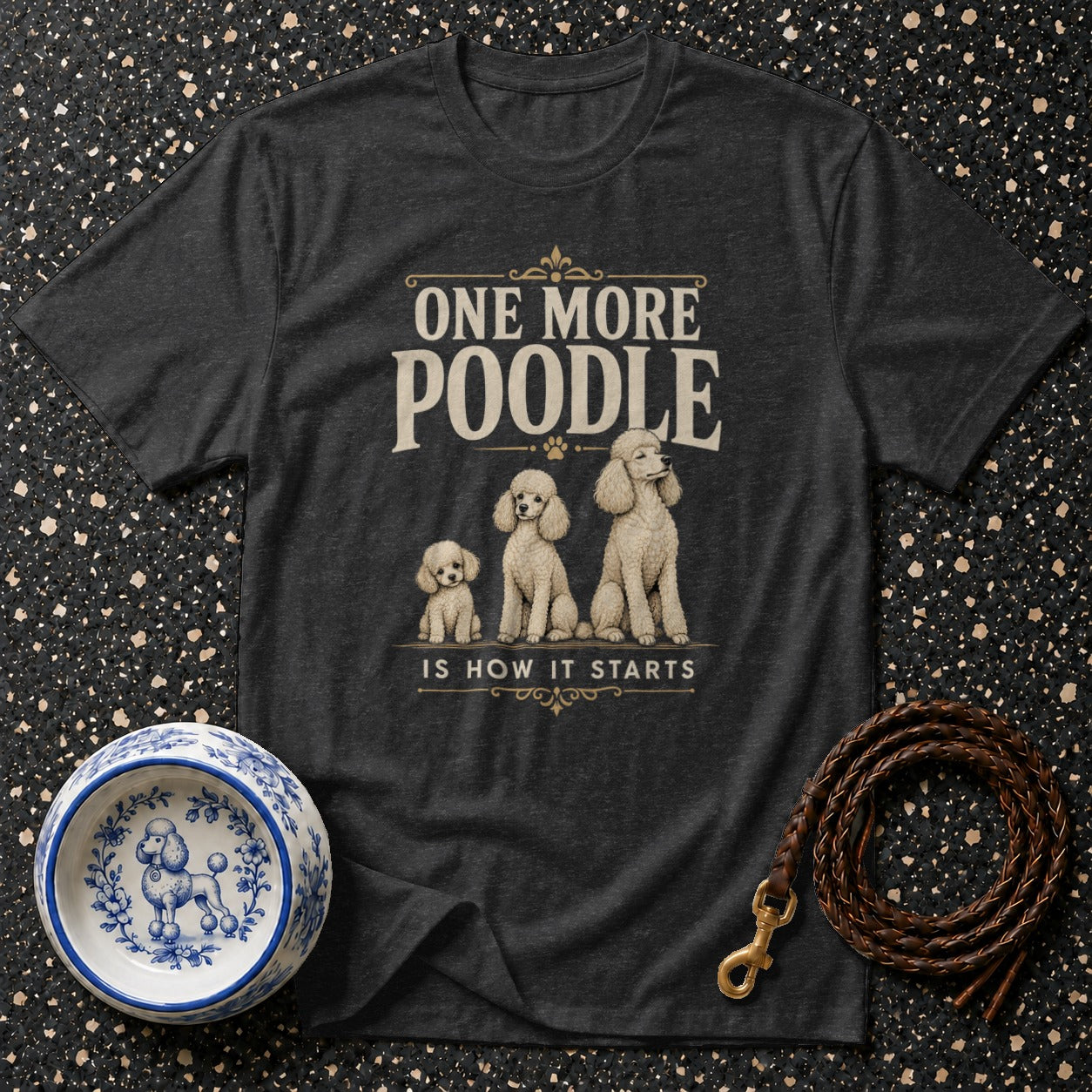 Dark t-shirt with "One More Poodle is How it Starts" and three poodles.