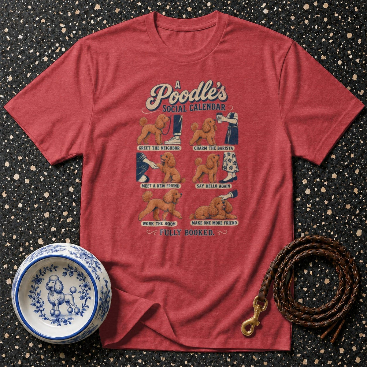 Red t-shirt with "A Poodle's Social Calendar" graphic depicting dog activities.