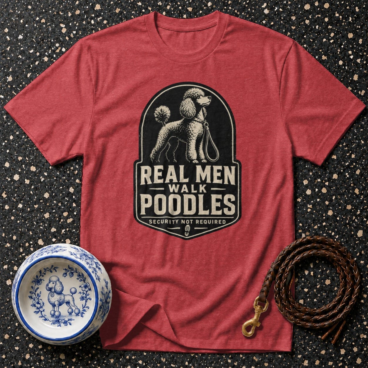 Red t-shirt with "Real Men Walk Poodles" graphic and leash and dog bowl.