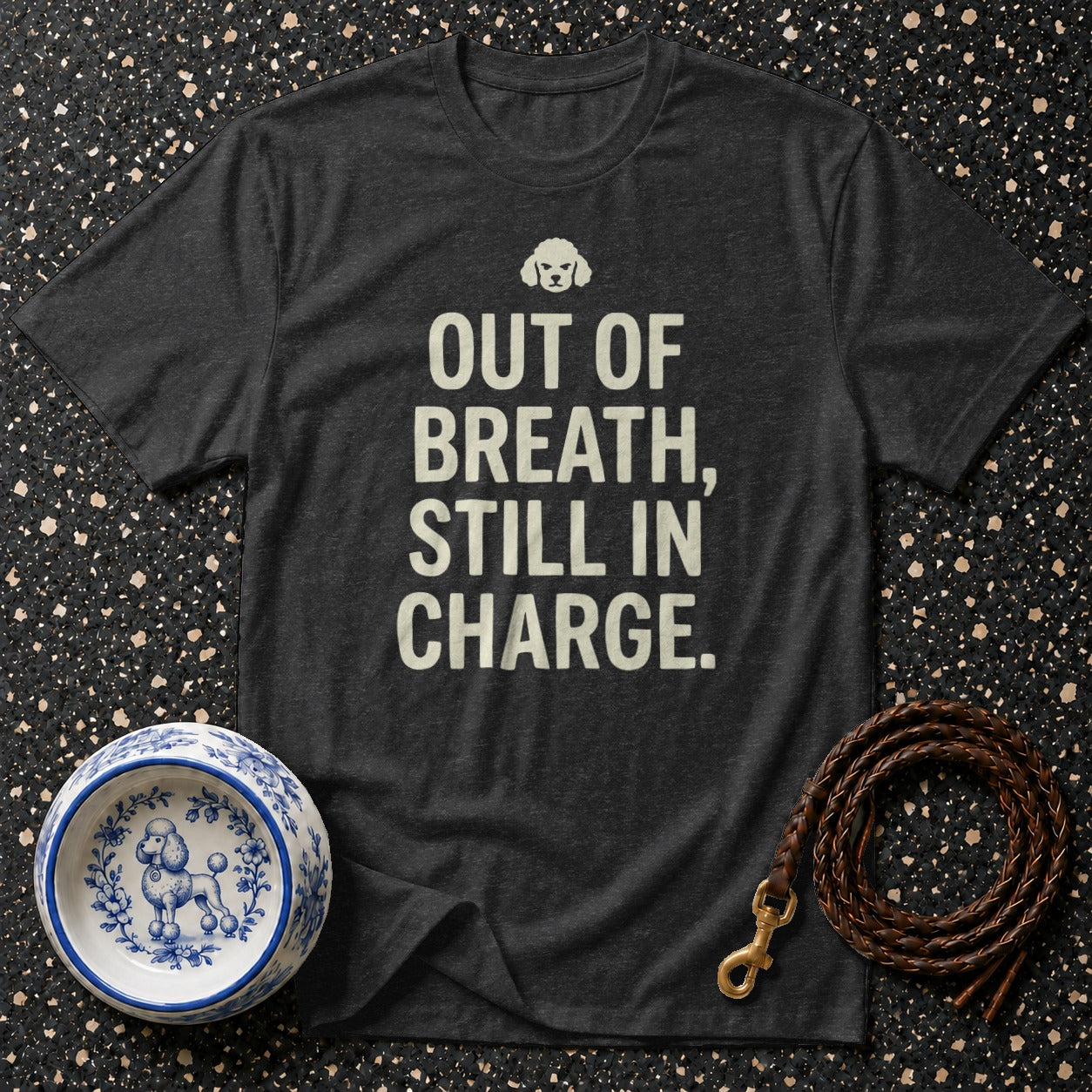 Dark grey t-shirt with white text "OUT OF BREATH, STILL IN CHARGE" above a poodle graphic.