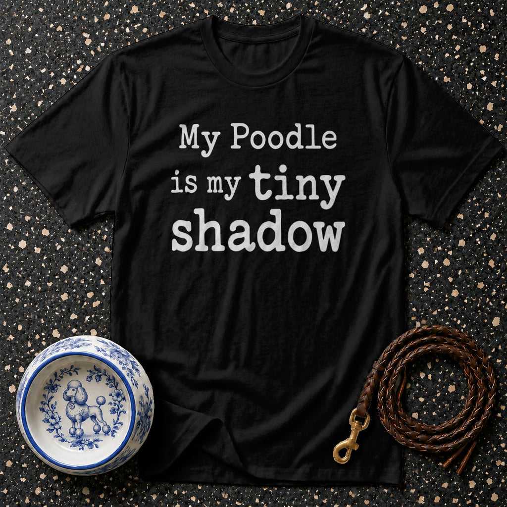Black t-shirt with white text "My Poodle is my tiny shadow".