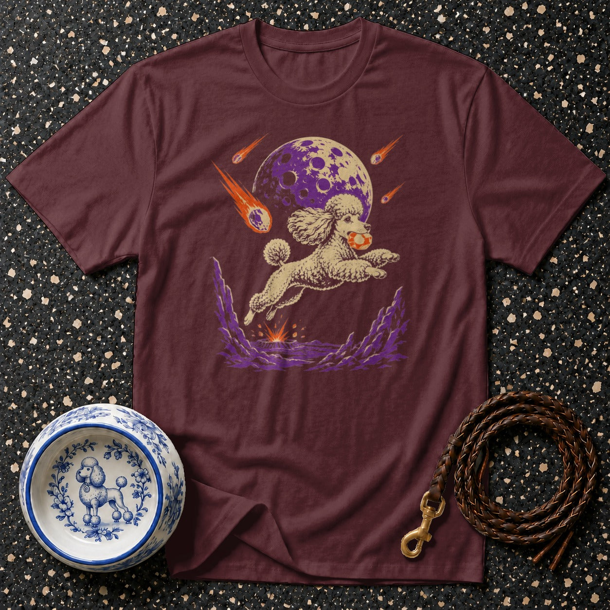 Burgundy t-shirt with a poodle design, moon, and meteors.