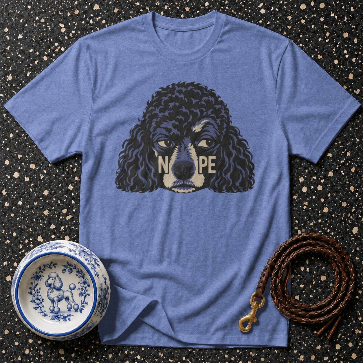 Blue t-shirt with a black poodle graphic that says "NOPE".