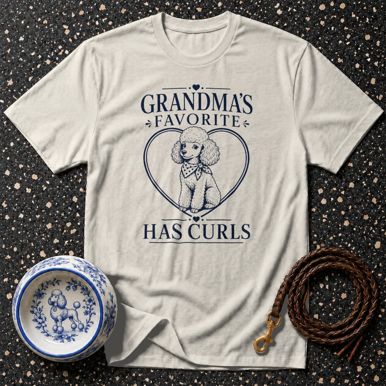 Light grey t-shirt with a poodle graphic and text "Grandma's Favorite Has Curls".
