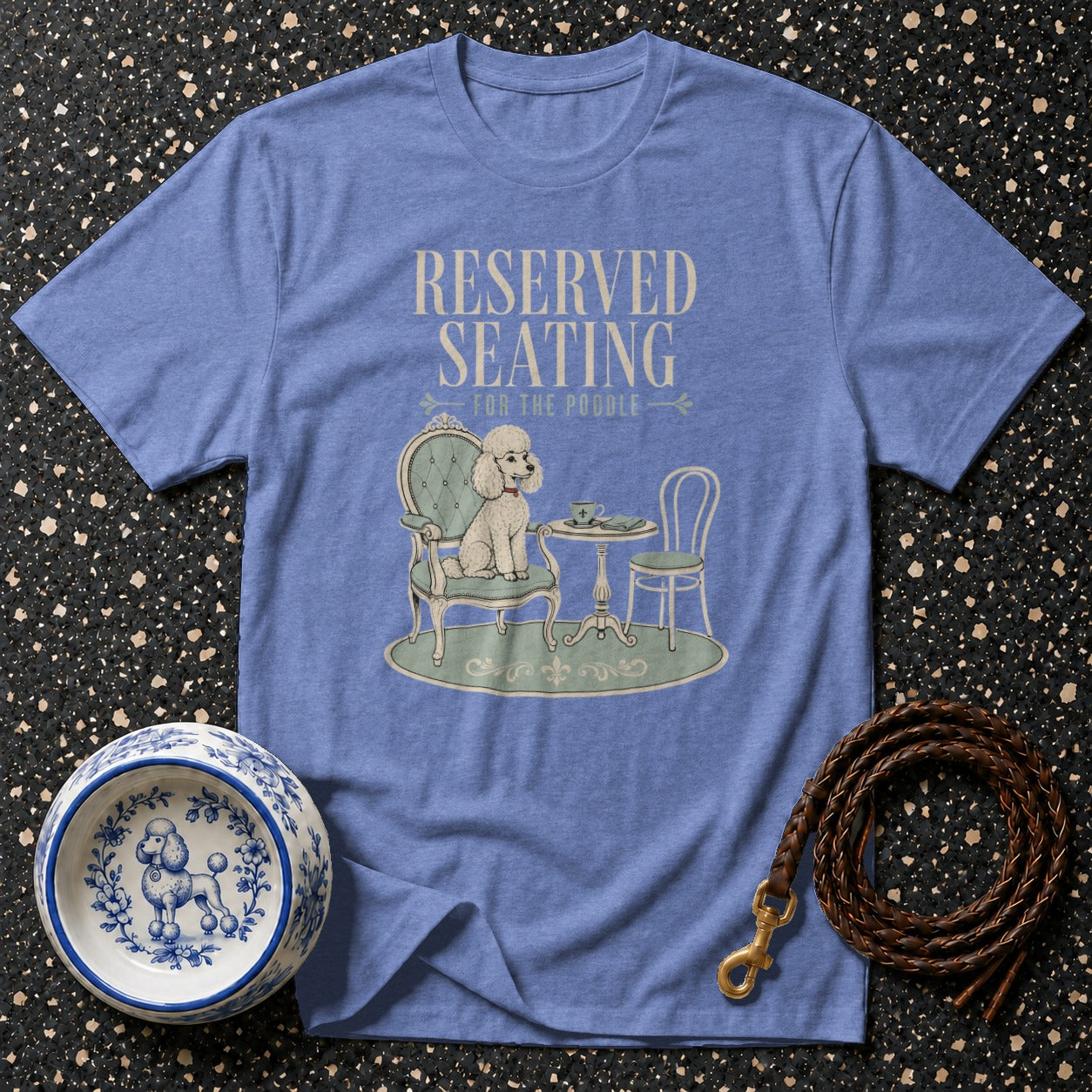 Blue t-shirt with "Reserved Seating for the Poodle" graphic and a poodle at a table.