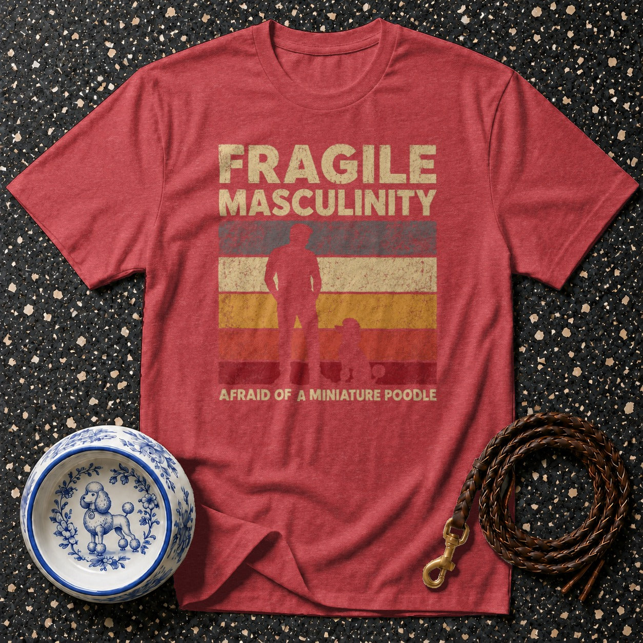 Red t-shirt with "Fragile Masculinity Afraid of a Miniature Poodle" text and graphic.