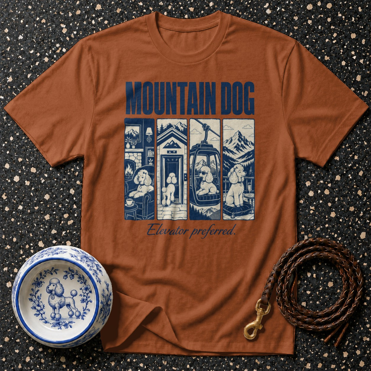 Brown t-shirt with "MOUNTAIN DOG" text and four panels of poodles, with "Elevator preferred."