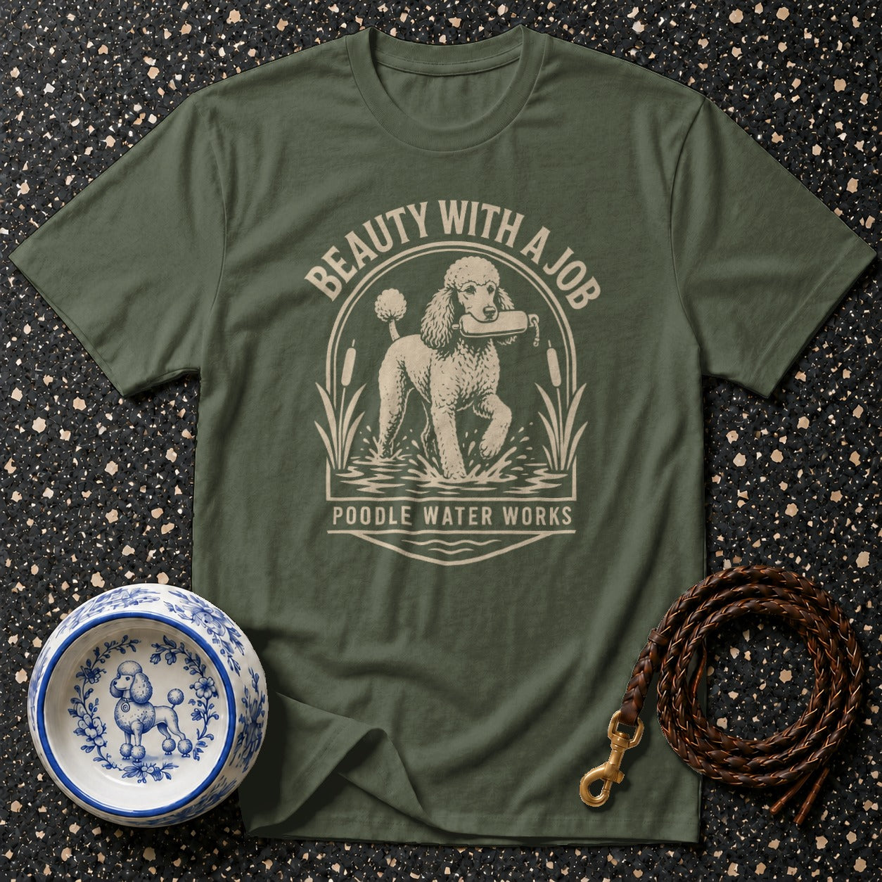 Olive green t-shirt with poodle in water design: "BEAUTY WITH A JOB POODLE WATER WORKS"