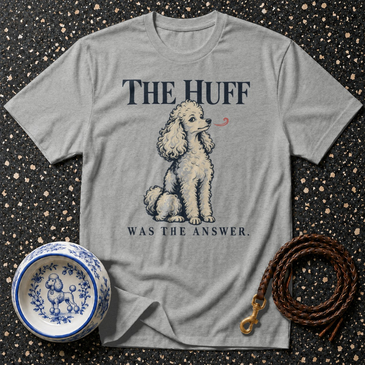 Grey t-shirt with illustration of a poodle and text "THE HUFF WAS THE ANSWER."